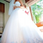 A bride prepares for her wedding day in the picturesque Seychelles, radiating joy and anticipation for her honeymoon.